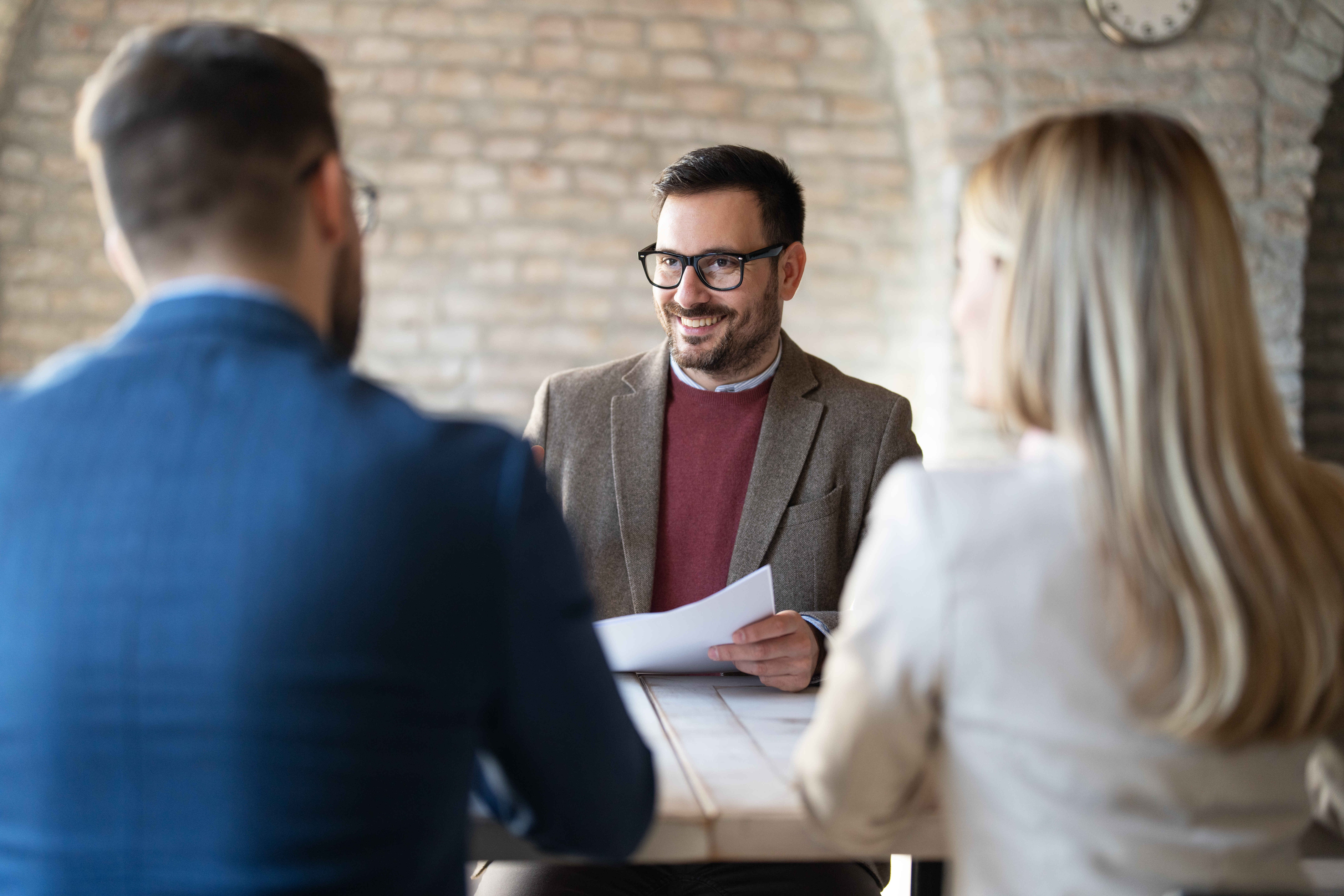 Broker consulting with clients about Funding's bridging, business and building loans